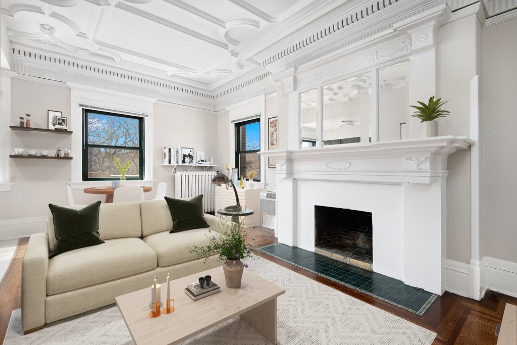 A living room with a fireplace and a couch.