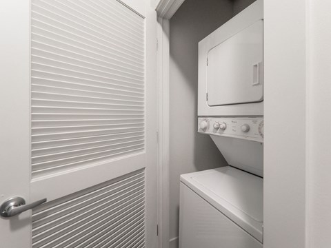 a small laundry room with a washer and dryer