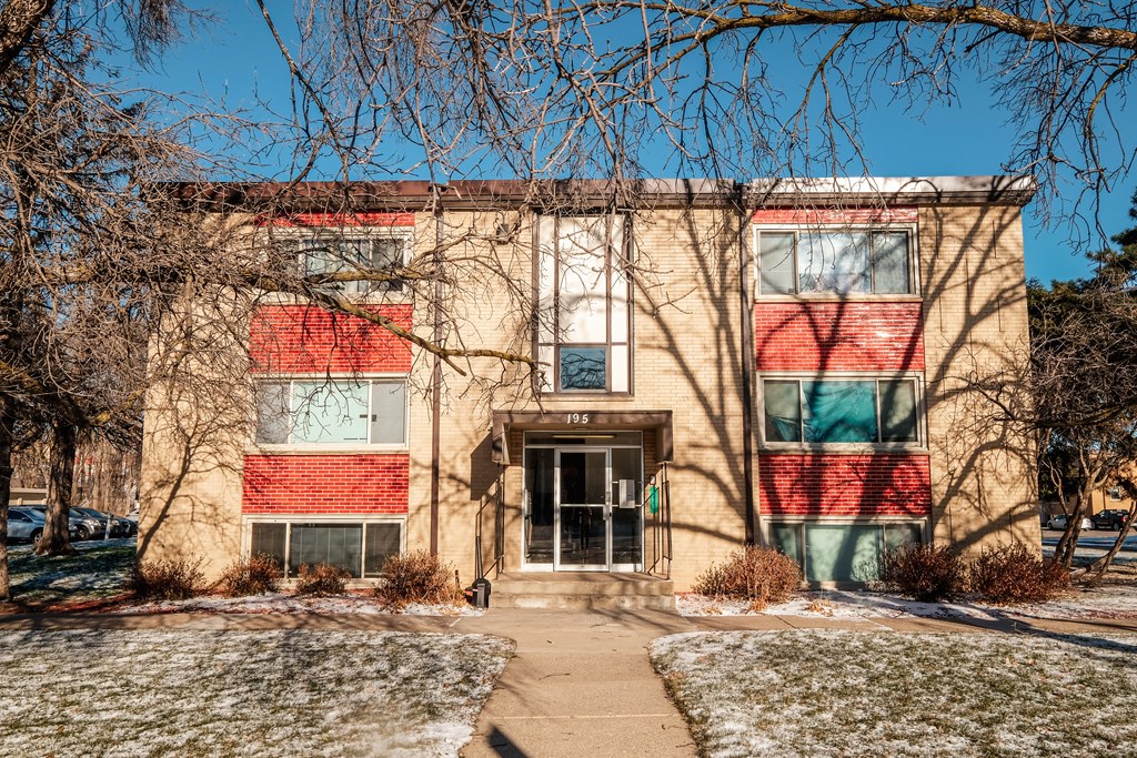 A building with a red and green striped wall.