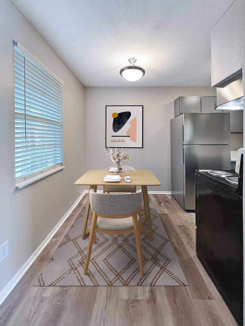 A dining room with a wooden table and a chair.