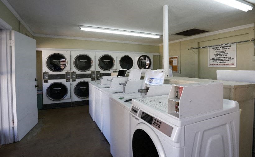 A laundromat with washers and dryers.