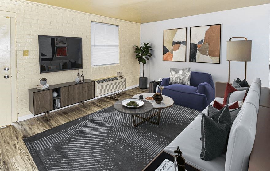 A living room with a blue chair and a grey couch.
