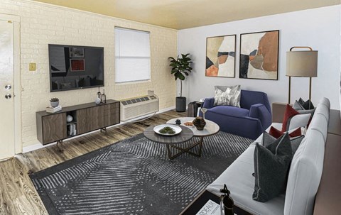A living room with a blue chair and a grey couch.