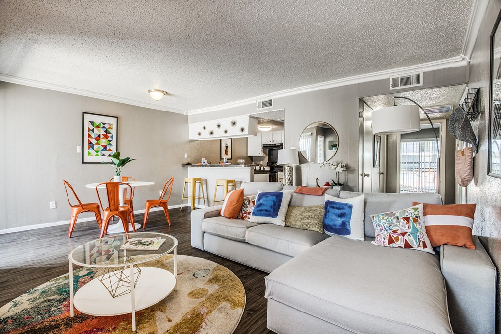 A living room with a white couch and a coffee table.
