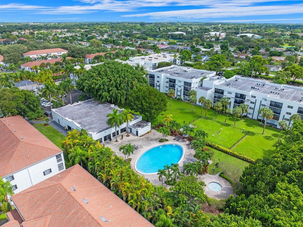 A bird's eye view of a resort with a swimming pool.
