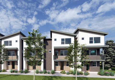A modern three-story apartment building with balconies and a landscaped front yard.