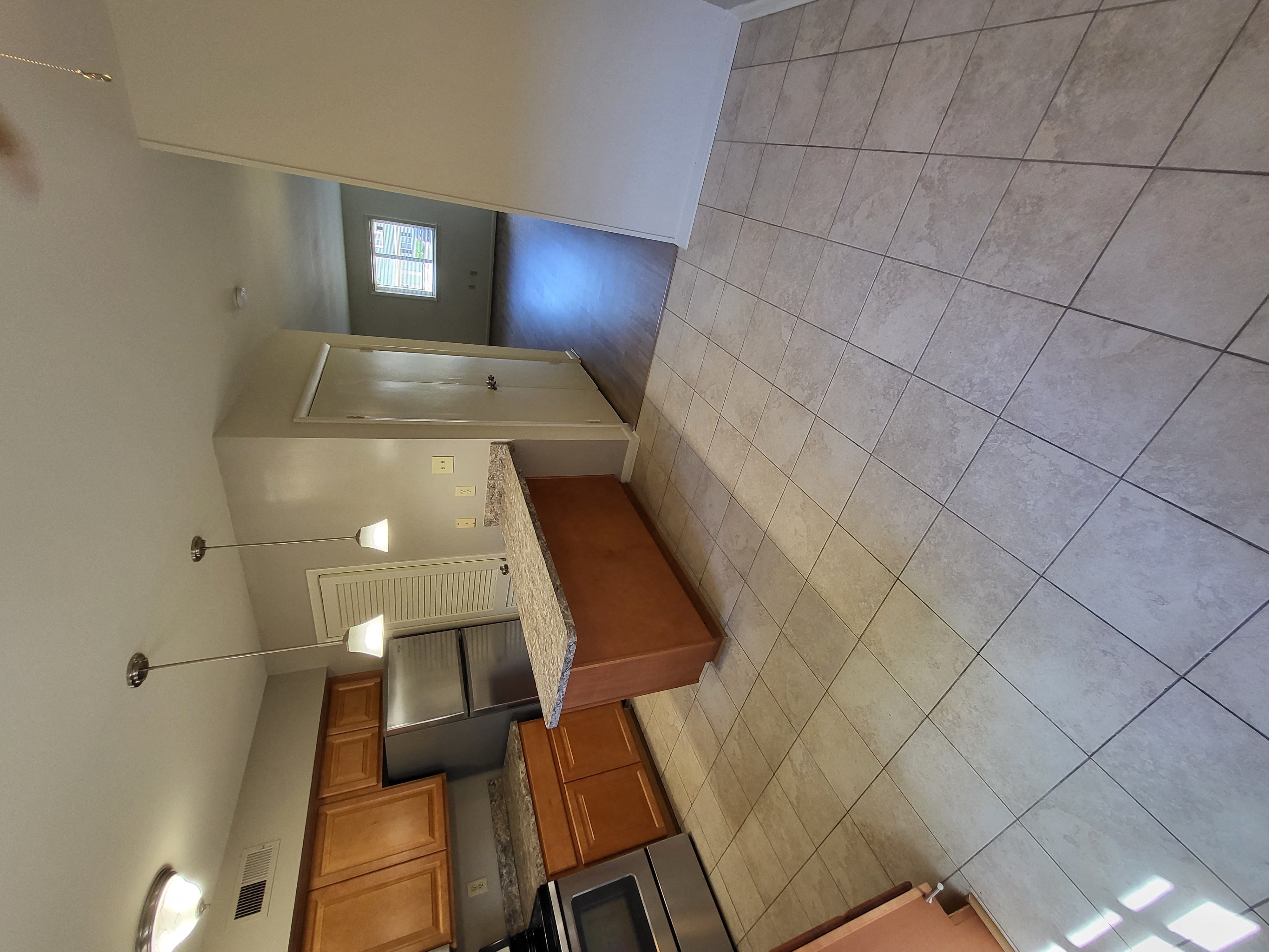 a look down into the kitchen from the loft