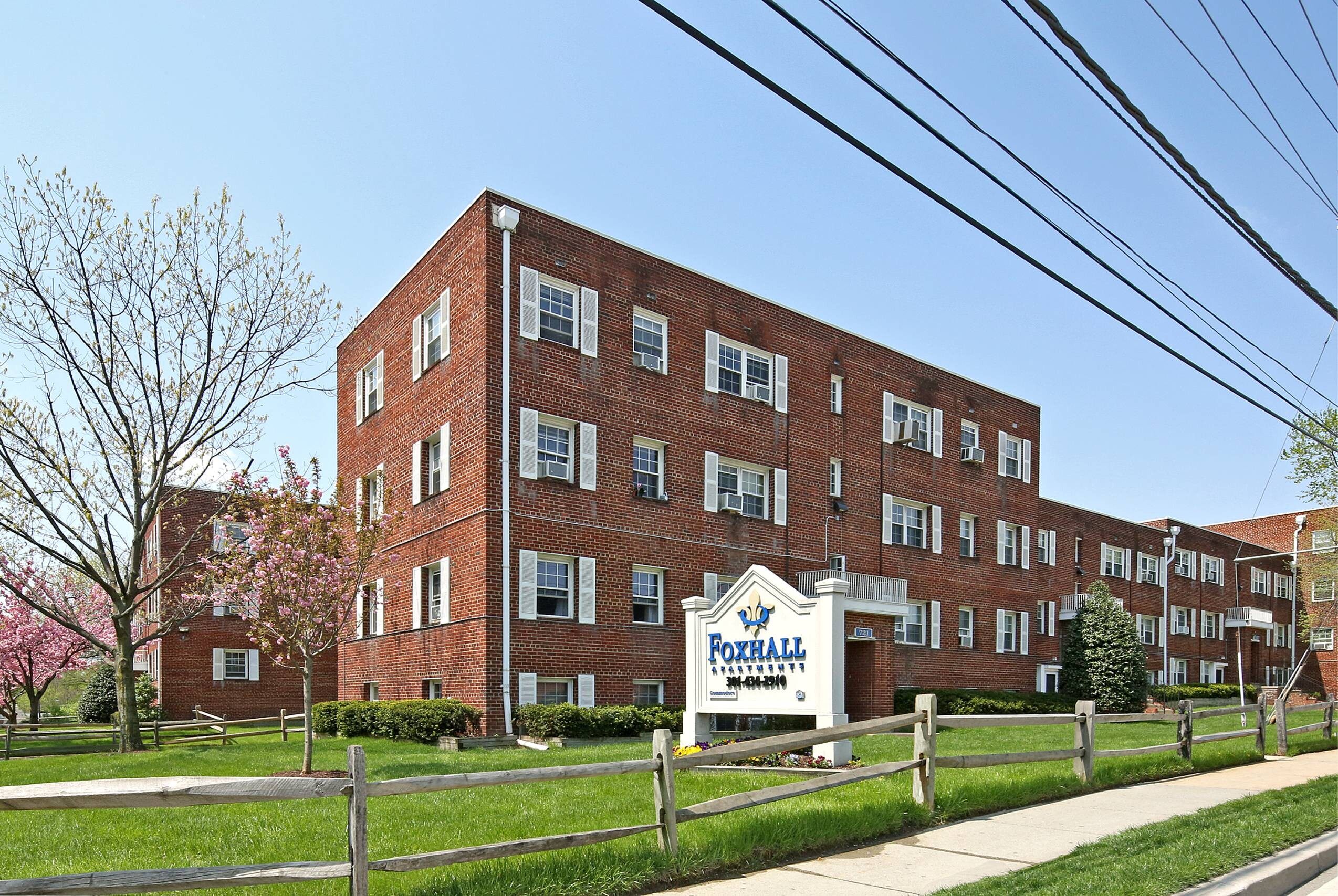 A brick building with a sign that says Foxhall.