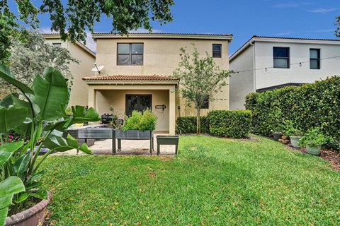 Private back patio with luscious garden.