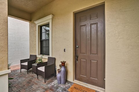Main entrance porch, chairs, and waterfall.