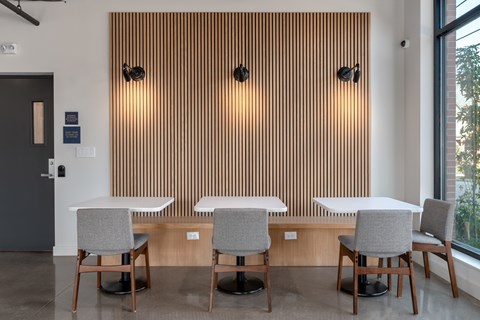 A conference room with a long table and chairs.