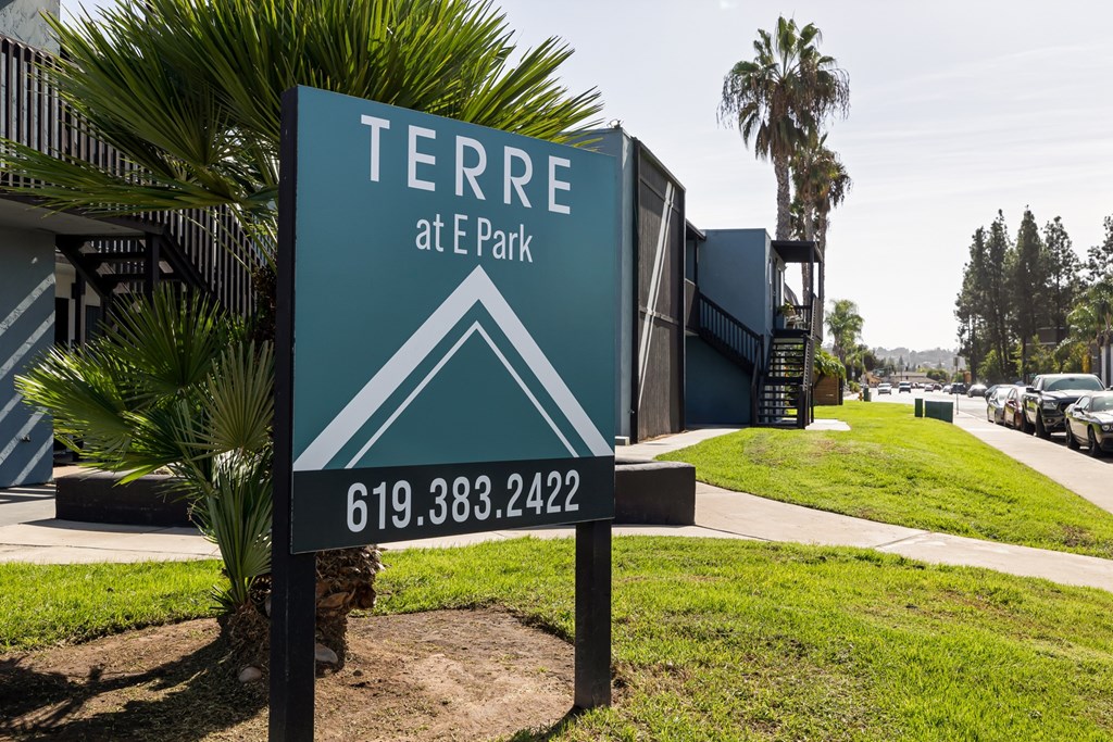 A sign for Terra at E Park with a phone number on it.