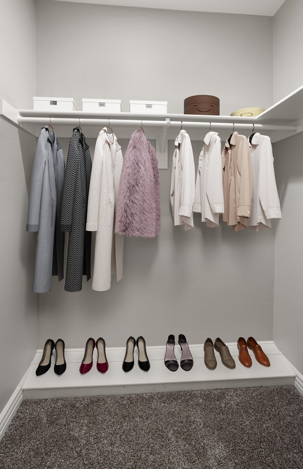 A row of shoes are lined up on a shelf.