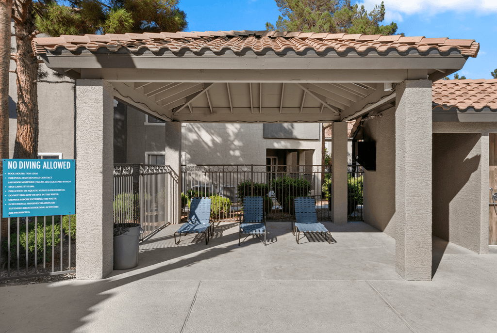 A sign on a fence states "NO DIVING ALLOWED".