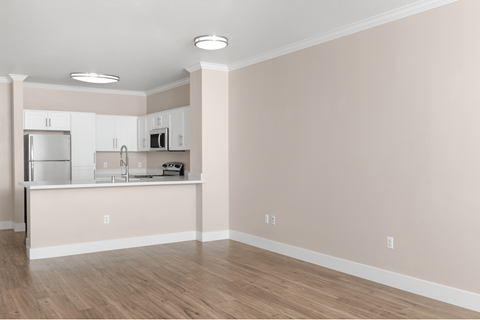 A kitchen with white appliances and a countertop.