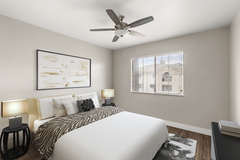 A bedroom with a bed, two lamps, a painting, and a window with blinds.