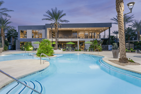 A modern house with a pool in the backyard.