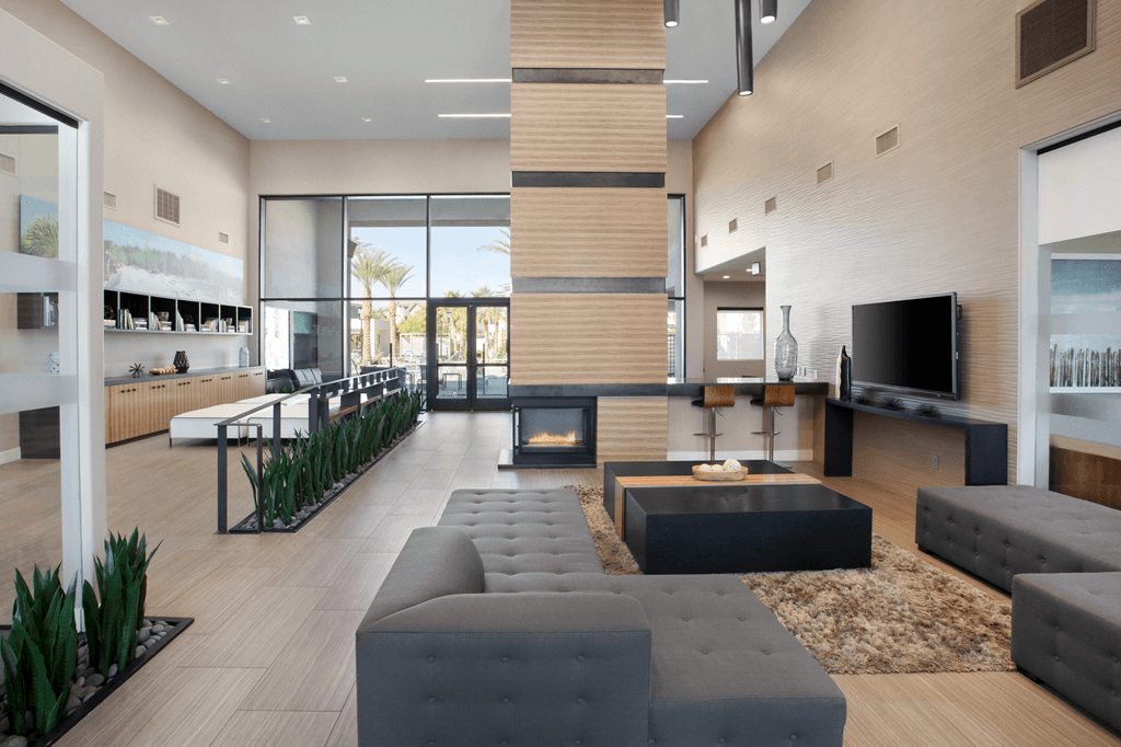 A modern living room with a fireplace and a television.