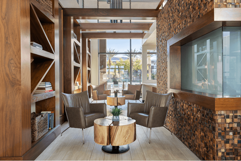 A modern living room with a glass table and chairs.
