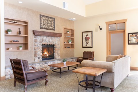 A living room with a fireplace and a couch.