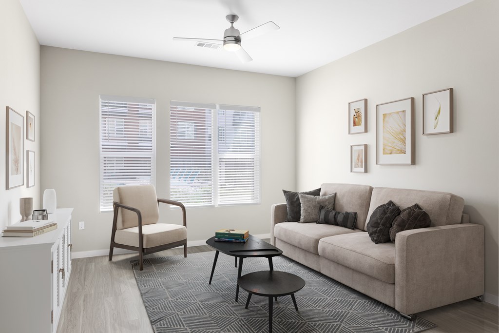 A living room with a couch, chair, and coffee table.