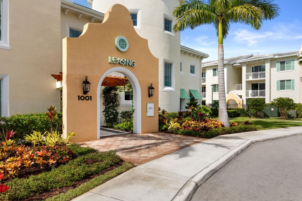 A building with a leasing sign on it.