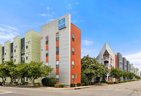A building with a blue sign that says "RESIDENTS" on it.