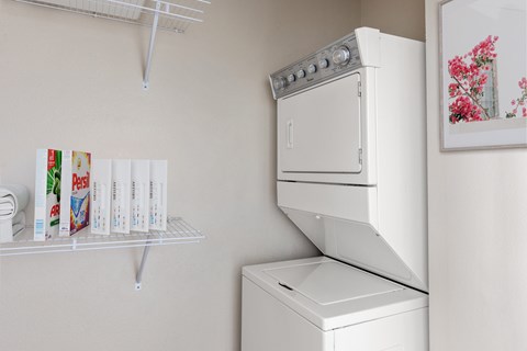 A white oven and dishwasher in a kitchen.