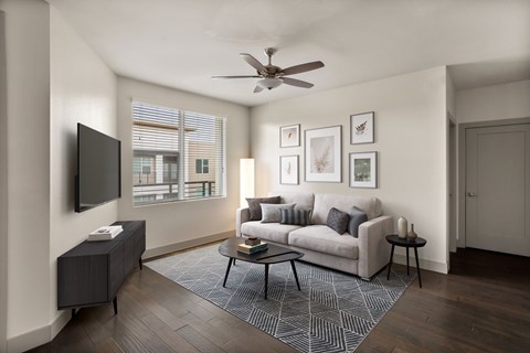 A living room with a couch, a television, and a coffee table.