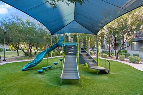 A playground with a slide and a ramp.