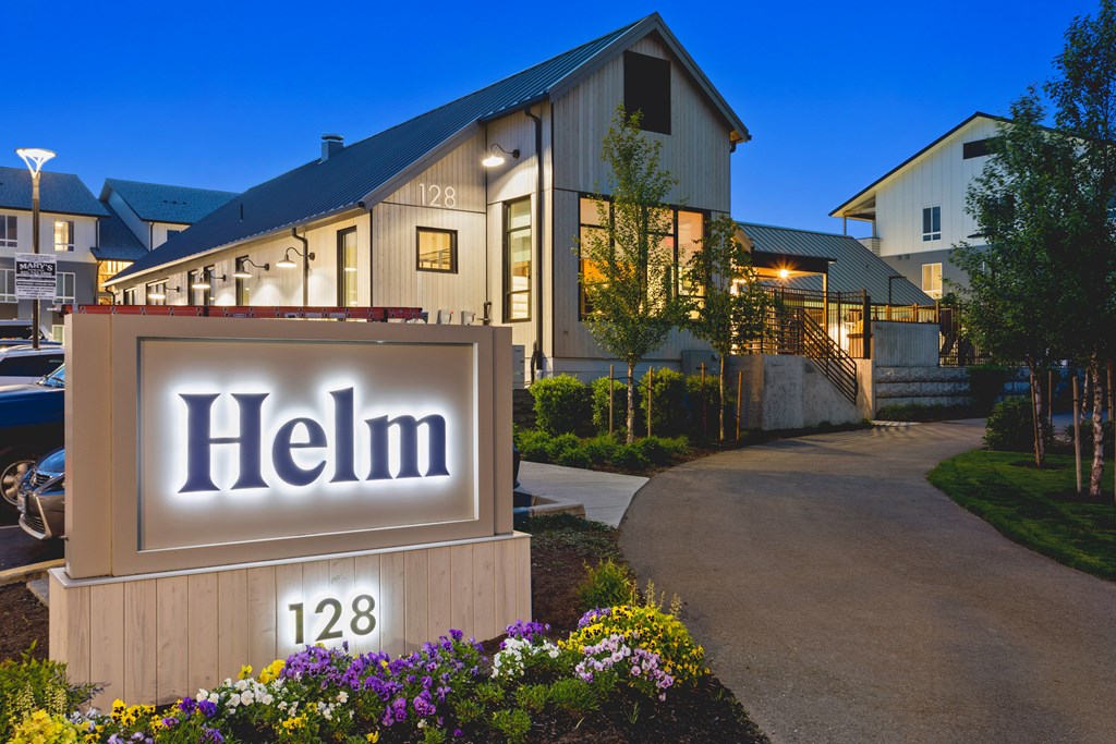 A sign that says Helm in front of a building.