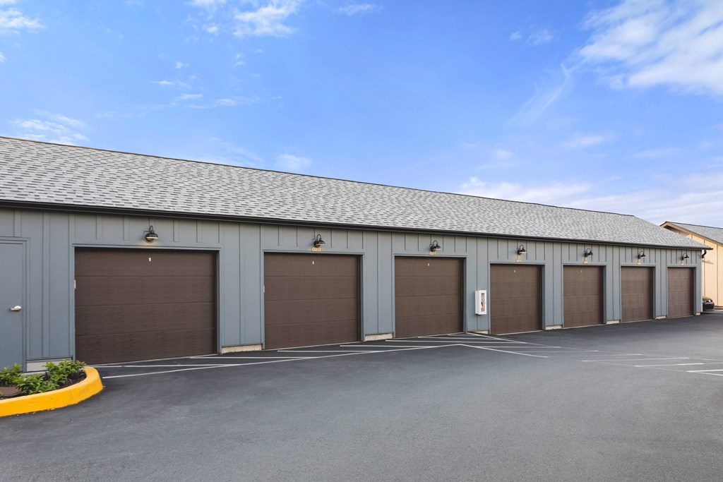 A long building with a row of garage doors.