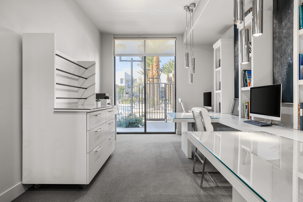 A modern kitchen with a large window overlooking a cityscape.