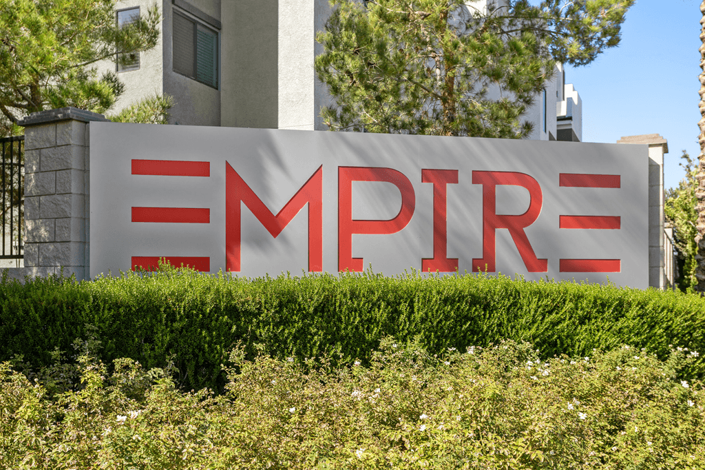 A sign with the word "EMPIRE" in red letters on a white background.