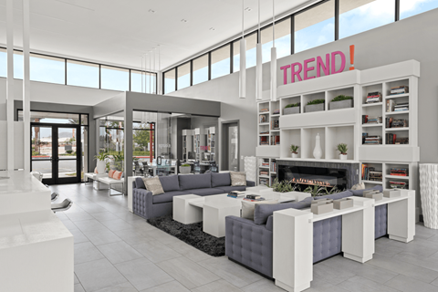 A modern living room with a grey and white color scheme.