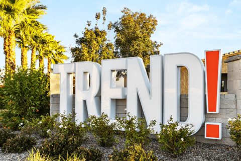 A large outdoor sign with the word "TREND" in bold letters.