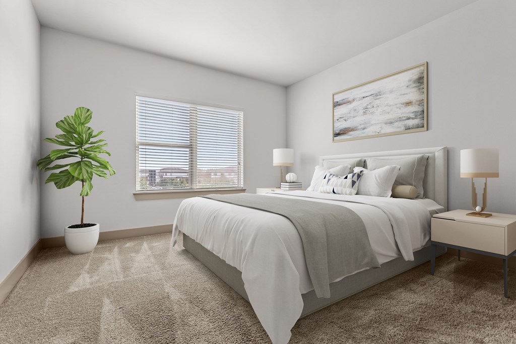 A bedroom with a bed, nightstand, and a plant.