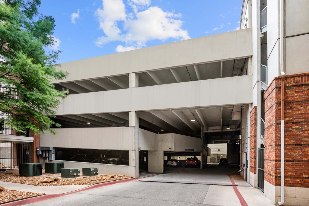 A parking garage with a clear blue sky in the background.