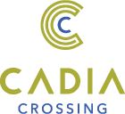 A logo with a blue and yellow design with the words CADIA CROSSING.