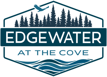 A logo with the text "EDGEWATER AT THE COVE" and a silhouette of a forest and waves below it.