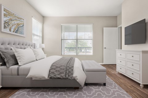 A bedroom with a large bed, a dresser, and a window with blinds.