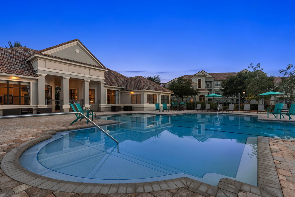 A large house with a pool in the backyard.