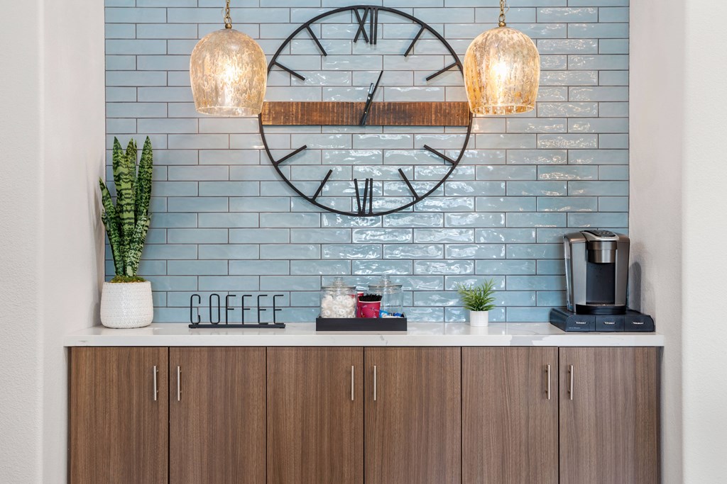 A coffee bar with a large clock on the wall.
