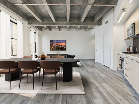 A modern dining room with a large table and chairs.