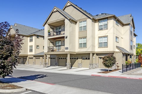 A large apartment complex with multiple buildings and balconies.