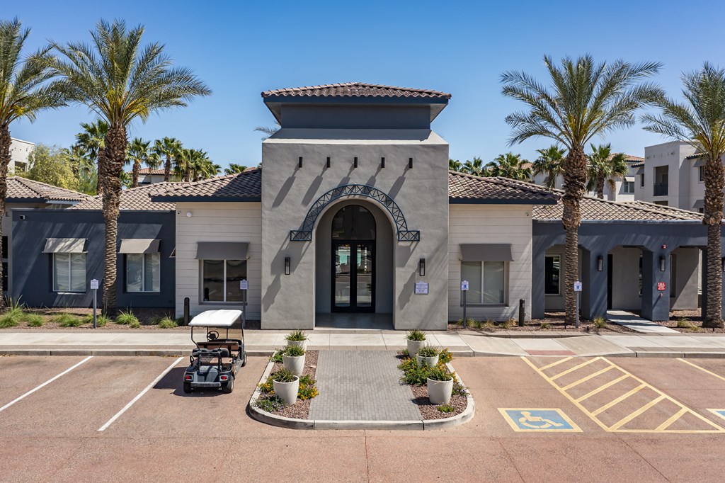 A building with a palm tree in front of it.