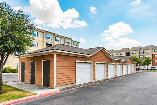 A row of garages in front of a building.