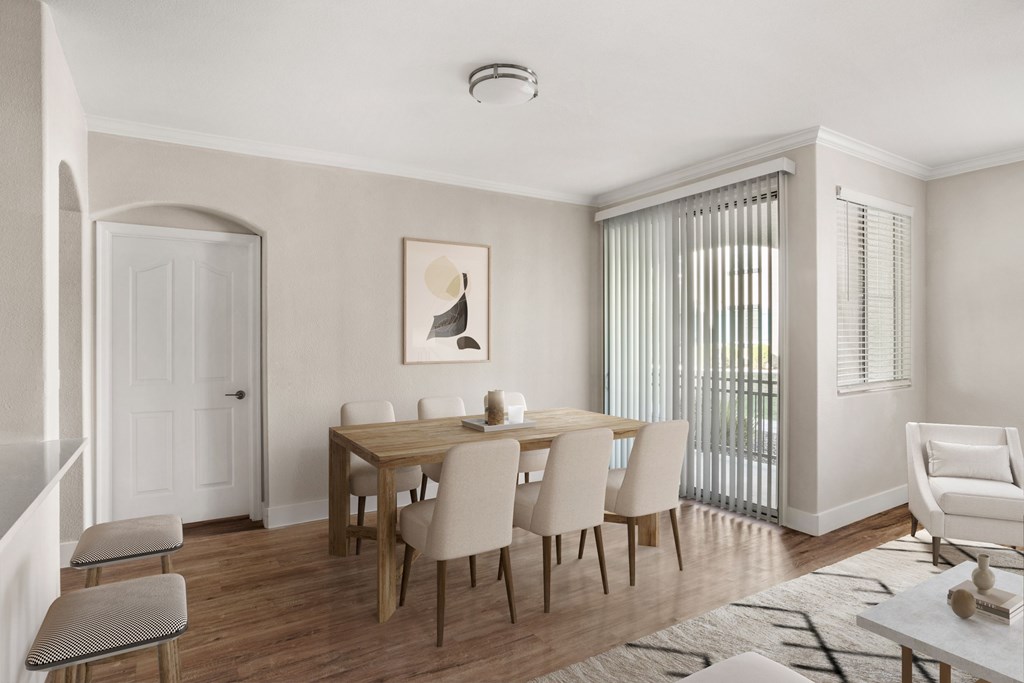 A dining room with a table set for six.