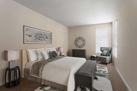 A bedroom with a large bed and a painting on the wall.