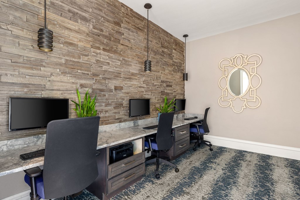 A room with a stone wall and a mirror on the wall.